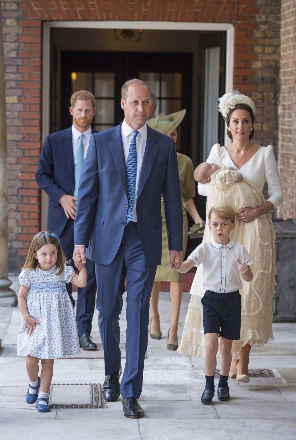 Princess Charlotte and Prince George hold the hands of their father, the Duke of Cambridge, as they arrive at the Chapel Royal, St James's Palace, London for the christening of their brother, Prince Louis.