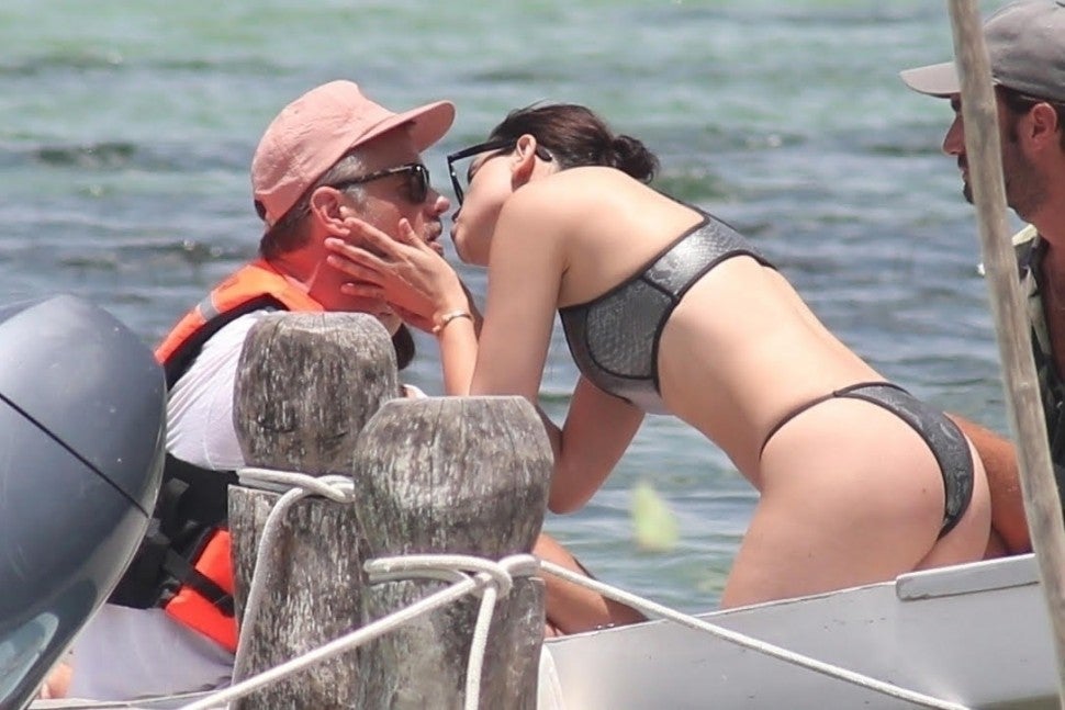 Eiza González and Josh Duhamel can't keep their hands off each while on vacation at Muyil Lagoon. The duo look smitten as they continuously kiss each other while enjoying their boat ride.