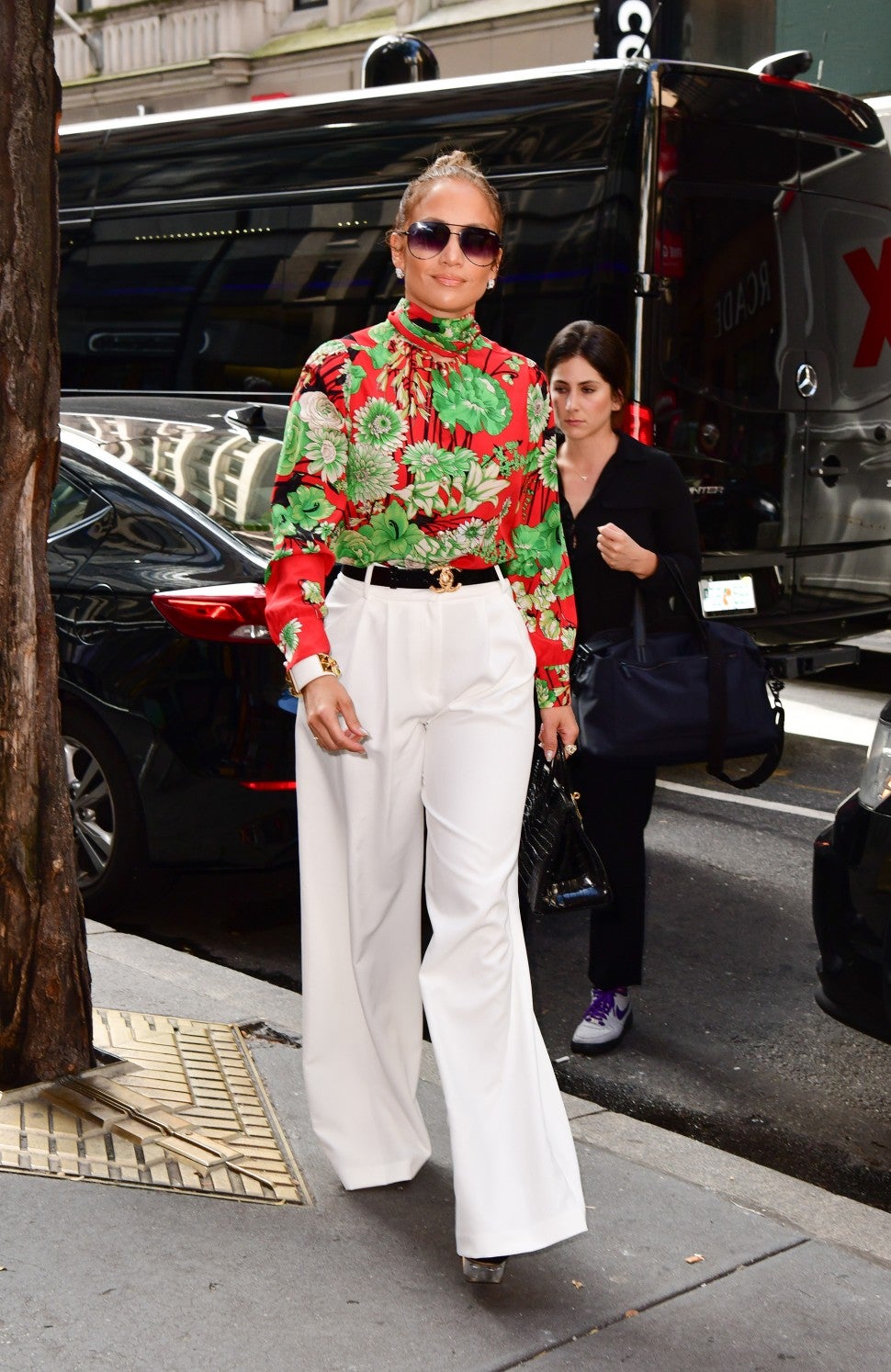 Jennifer Lopez floral top and white pants