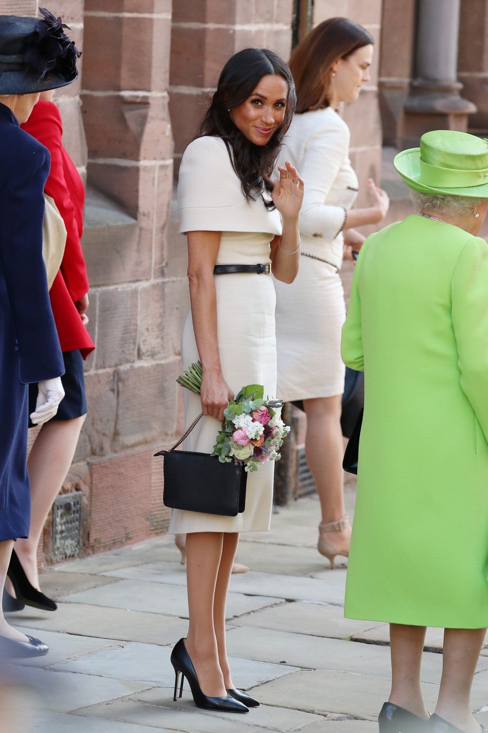 Meghan Markle black clutch and shoes