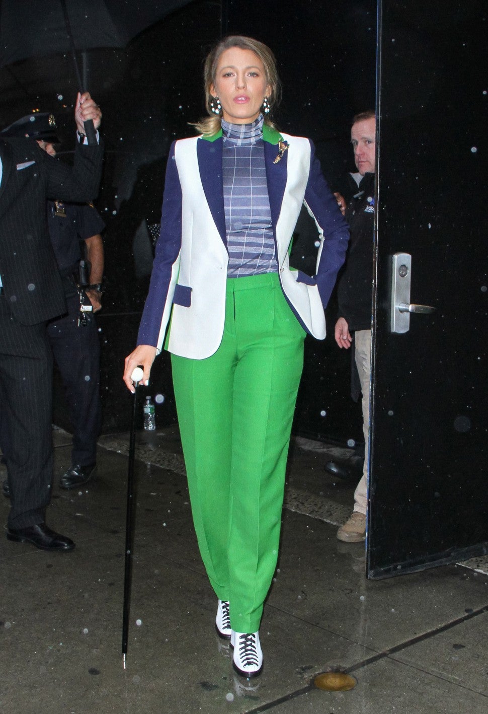 Blake Lively in green suit pants and cane
