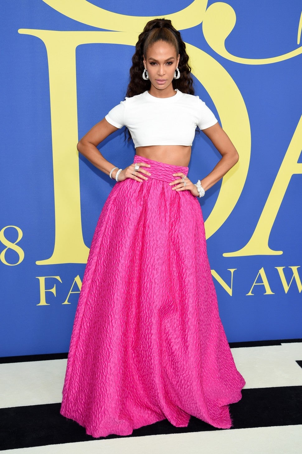 Joan Smalls pink skirt and white tee