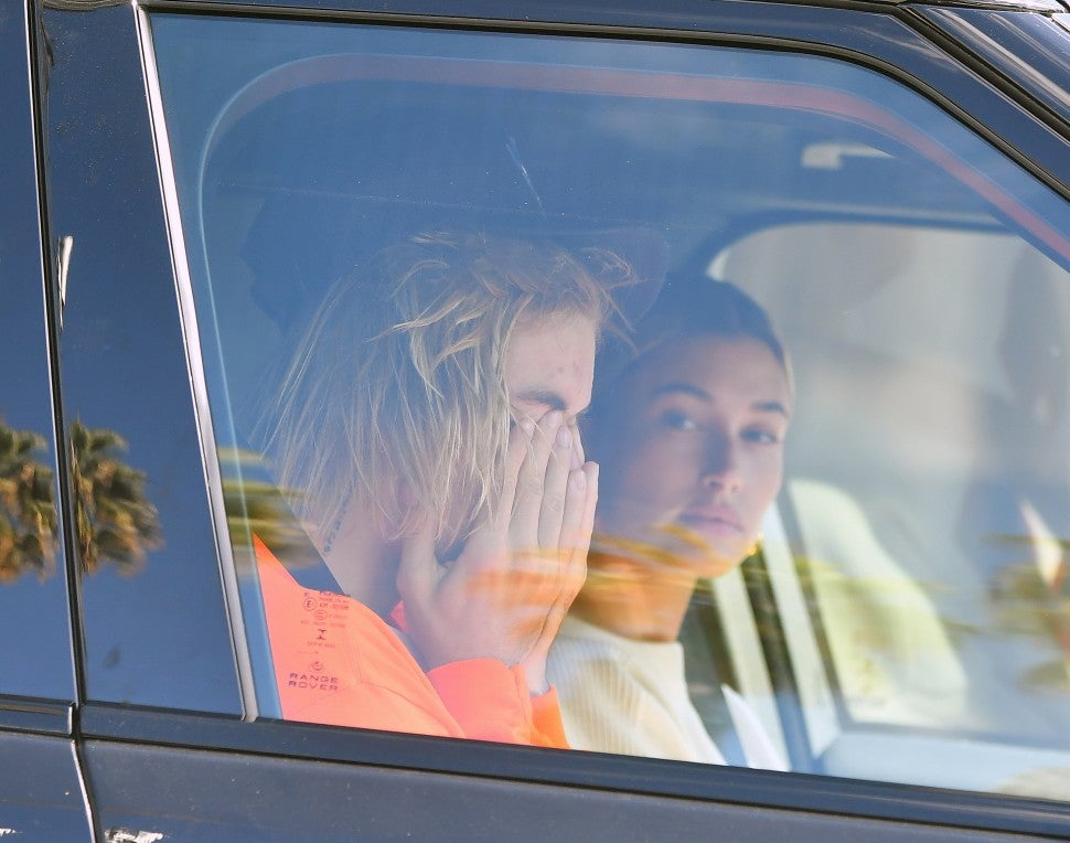 Justin Bieber looks worse for wear as he and Hailey Baldwin drive to their Pastor's house in Beverly Hills. Justin Appears to be crying.