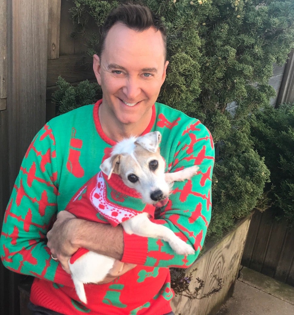 Clinton Kelly and dog Christmas sweaters