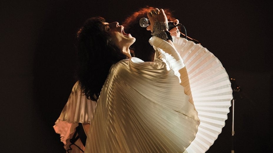 Rami Malek as Freddie Mercury in white batwing top