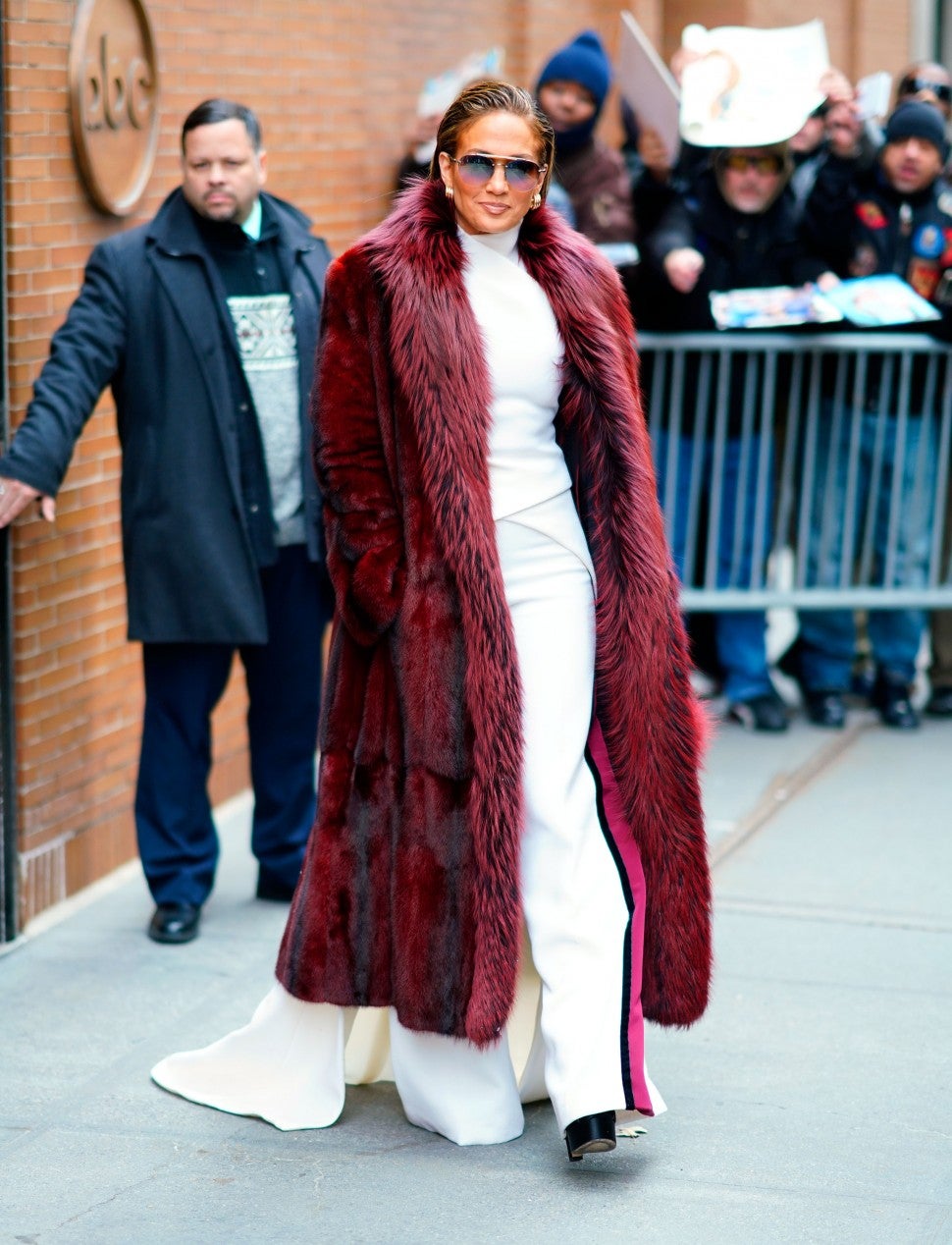 Jennifer Lopez in burgundy fur coat
