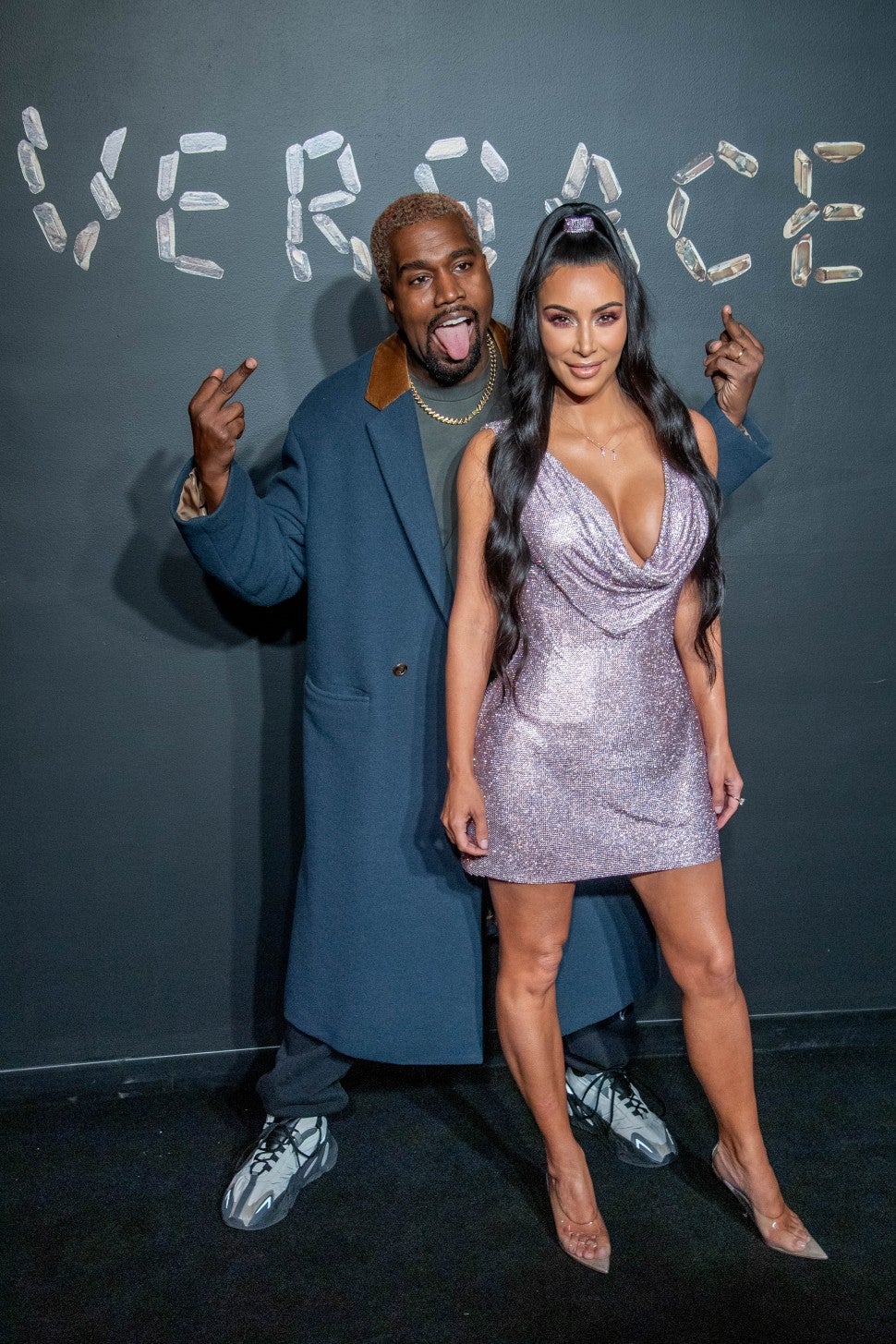 Kanye West and Kim Kardashian West attend the the Versace fall 2019 fashion show at the American Stock Exchange Building in lower Manhattan on December 02, 2018 in New York City.