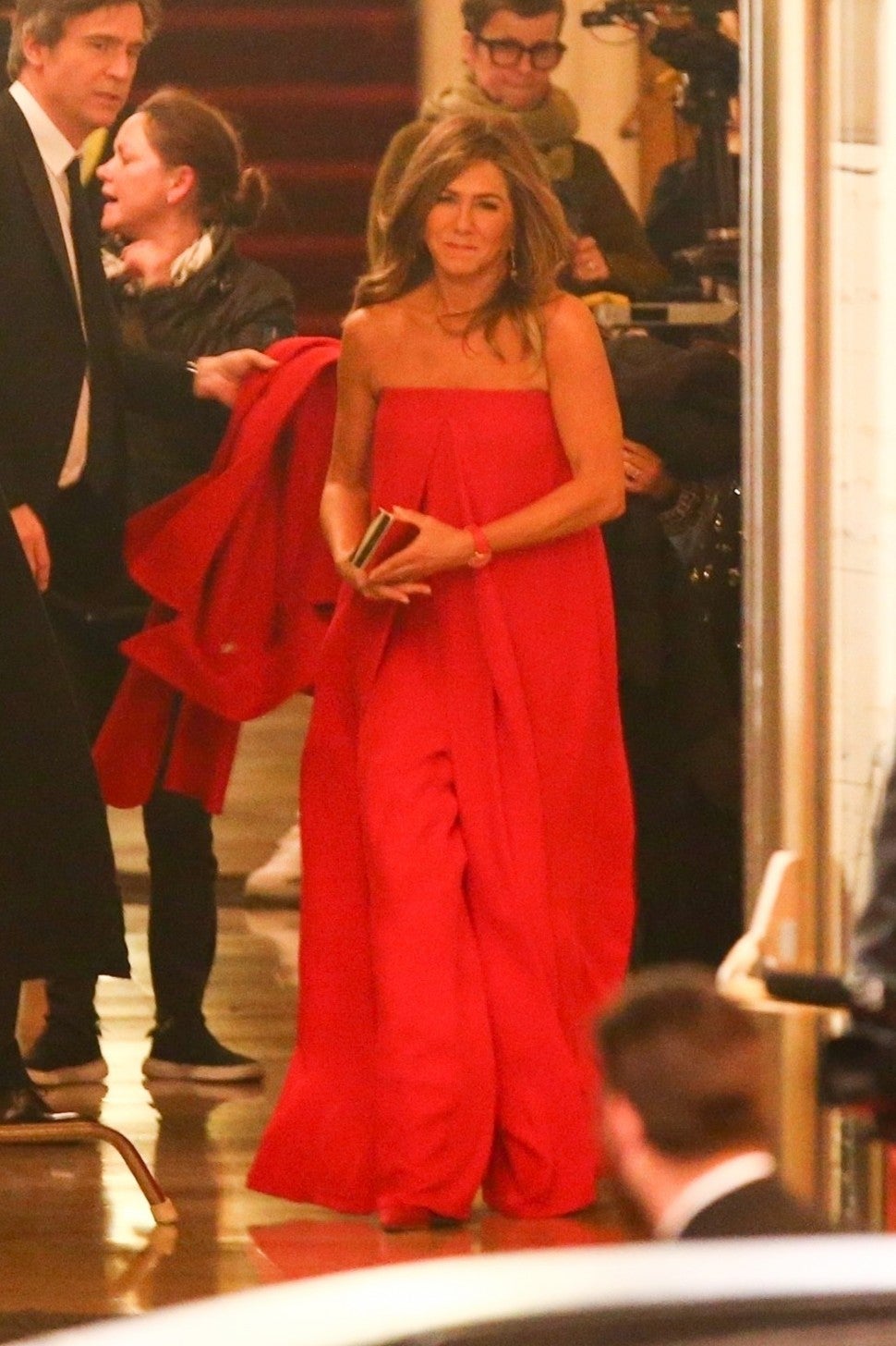 Jennifer Aniston stuns in red on set of 'Top of the Morning' while filming in Downtown Los Angeles. 