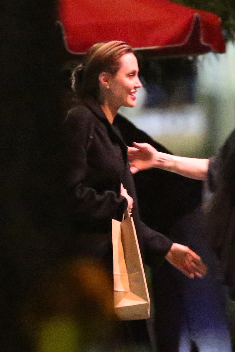 Angelina Jolie having dinner with friends at Rao's restaurant in L.A.