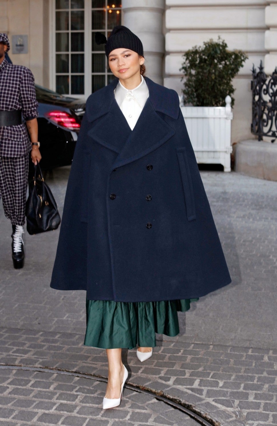 Zendaya in cape coat at Paris Fashion Week