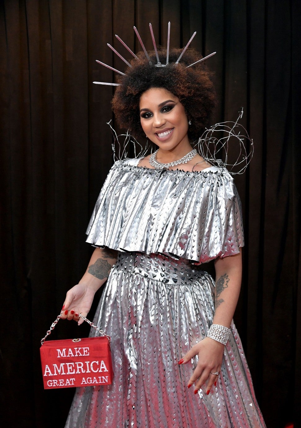 Princess Joy Villa at Grammys with MAGA bag
