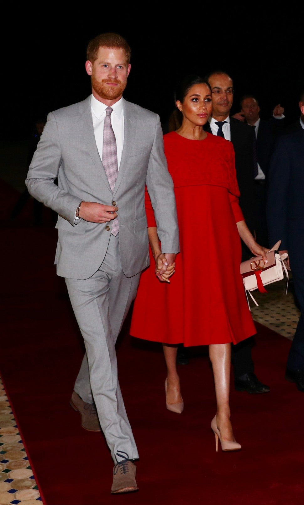 Meghan Markle in red dress with Prince Harry in Morocco