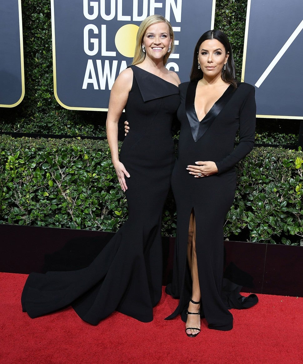 Reese Witherspoon;Eva Longoria arrives at the 75th Annual Golden Globe Awards at The Beverly Hilton Hotel on January 7, 2018 in Beverly Hills, California.