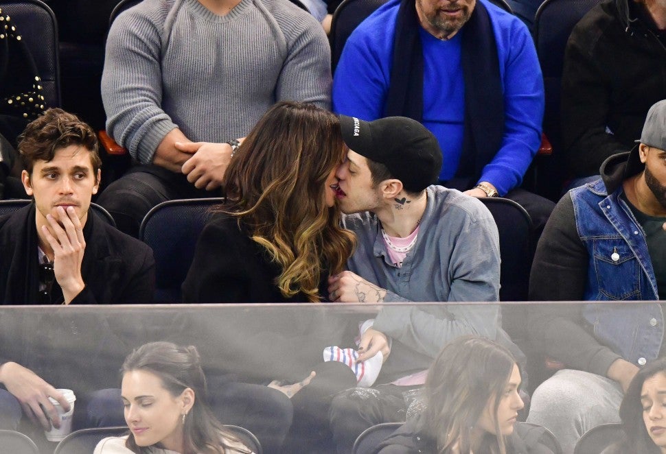 Pete Davidson and Kate Beckinsale kissing at a New York Rangers game