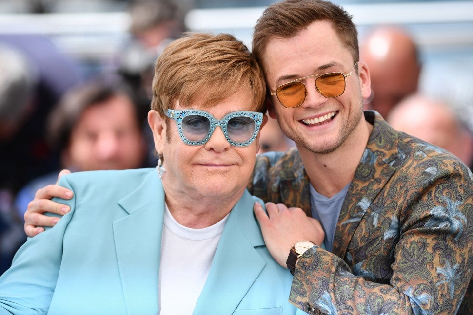 Elton John and Taron Egerton pose during the photocall for the film 'Rocketman' at the 72nd annual Cannes International Film Festival in Cannes, France on May 16, 2019. 