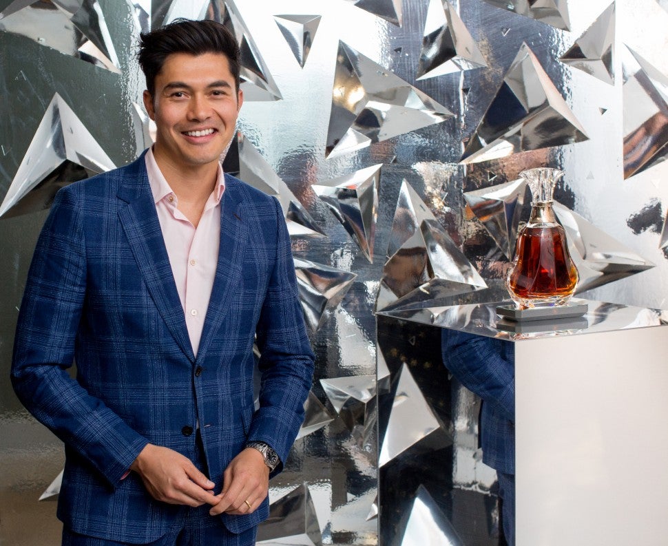 Henry Golding with hennessy