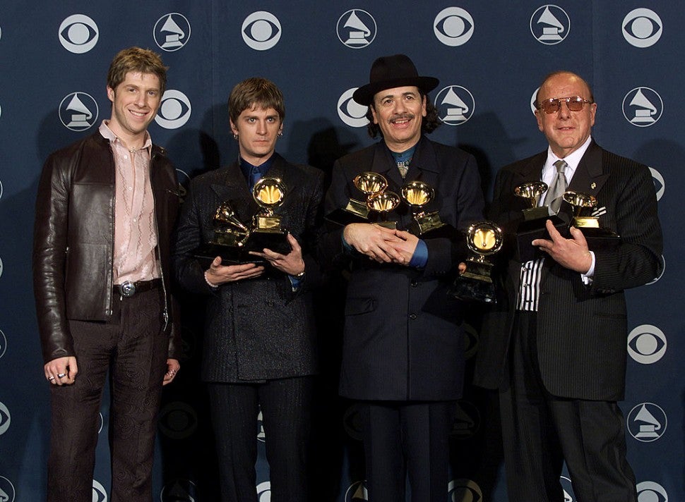 Songwriter, Itaal Shur, musicians Rob Thomas and Carlos Santana, and music executive Clive Davis at the 2000 GRAMMY Awards.