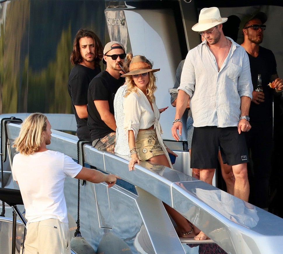 Chris Hemsworth, Elsa Pataky, Matt Damon and is wife Luciana Barroso enjoy a day on a yacht. Matt and his wife share an tender moment together on July 14th 2019 in Ibiza, Spain