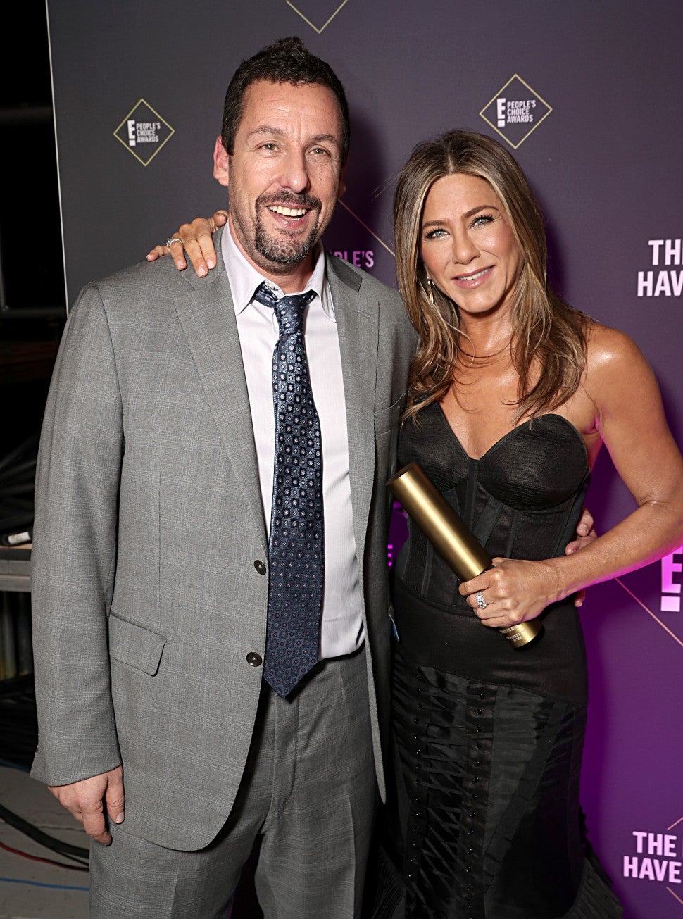 Adam Sandler and Jennifer Aniston pose backstage during the 2019 E! People's Choice Awards 