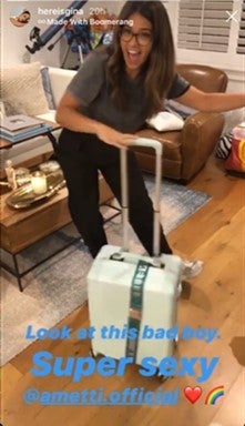 gina rodriguez with luggage
