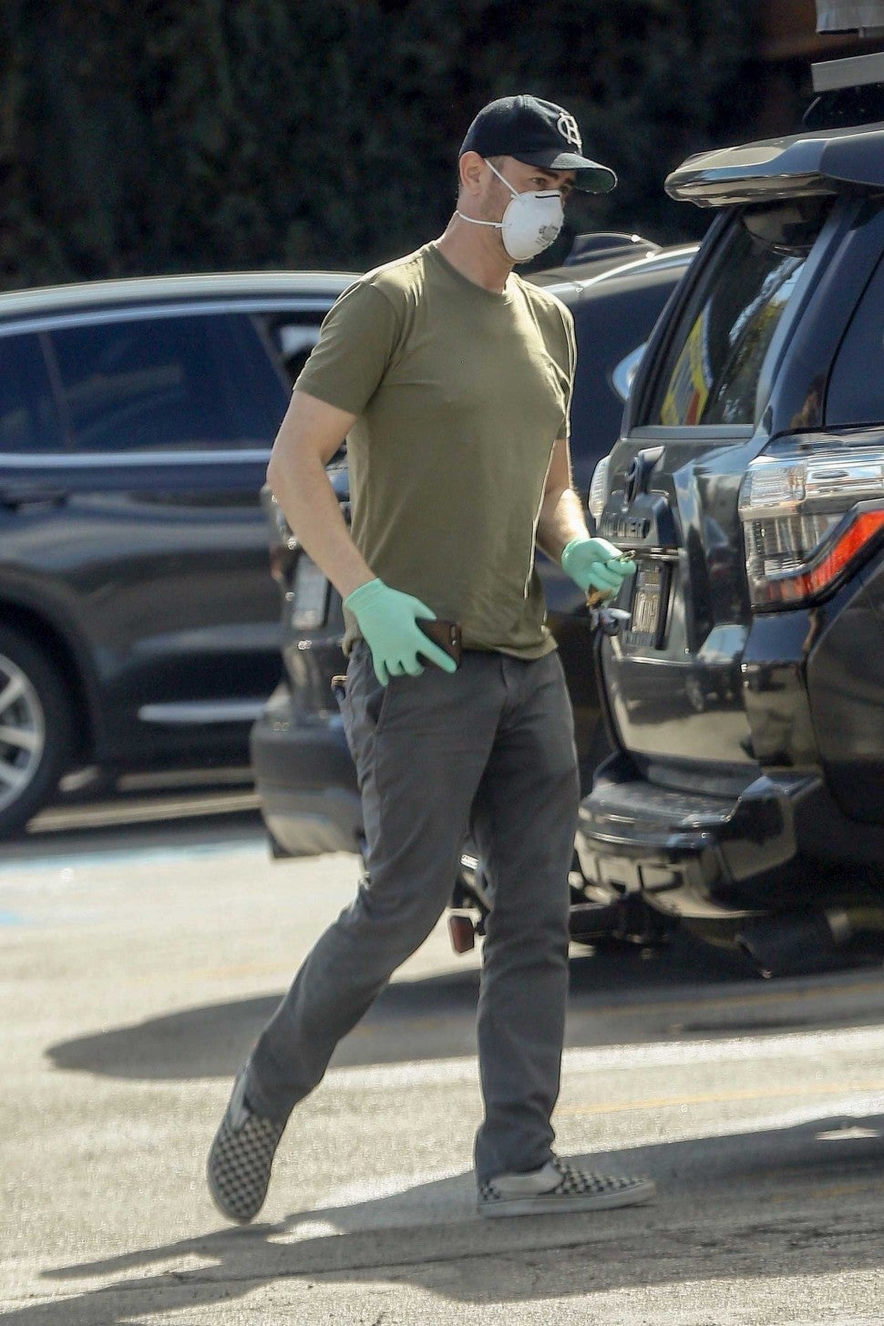 colin hanks wears face mask and gloves on 3/25