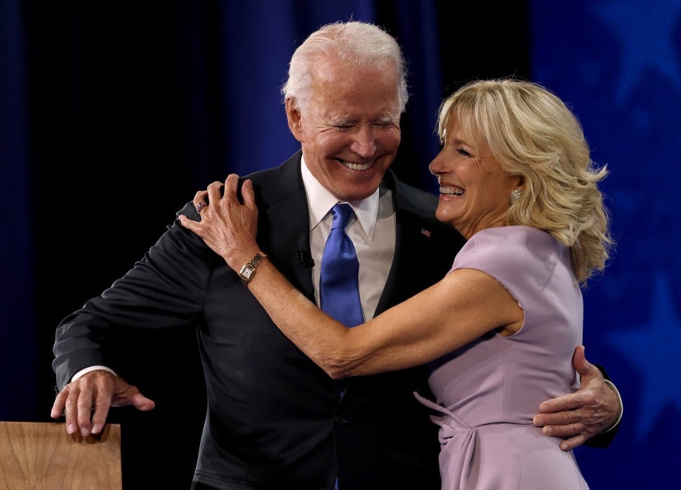 Joe Biden greets his wife Dr. Jill Biden on the fourth night of the Democratic National Convention from the Chase Center on August 20, 2020 in Wilmington, Delaware.