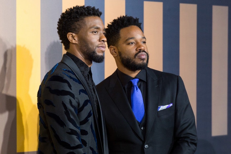 Chadwick Boseman (L) and Ryan Coogler (R) arrives for the European film premiere of Black Panther in London, United Kingdom, on February 08, 2018 