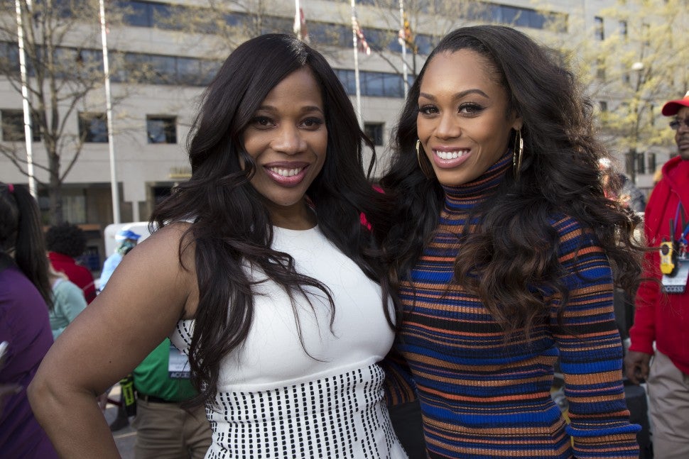 Monique Samuels and Charisse Jackson Jordan attend an Emancipation Day event in 2018.