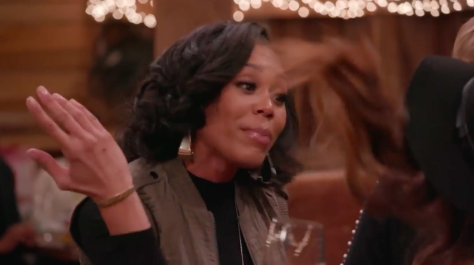 Monique Samuels flicks co-star Candiace Dillard's hair on 'The Real Housewives of Potomac.'