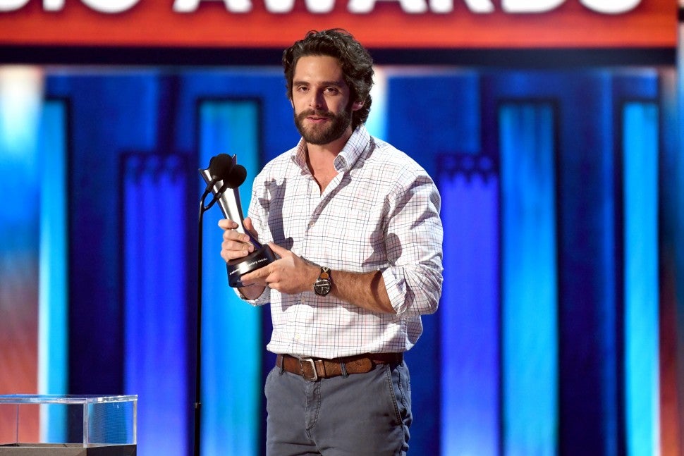 Thomas Rhett poses with the Entertainer of the Year award onstage during the 55th Academy of Country Music Awards at the Grand Ole Opry on September 16, 2020 in Nashville, Tennessee. The ACM Awards airs on September 16, 2020 with some live and some prerecorded segments.