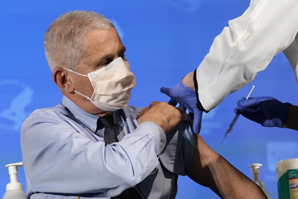 Anthony Fauci, director of the National Institute of Allergy and Infectious Diseases, prepares to receive his first dose of the Covid-19 vaccine at the National Institutes of Health on December 22, 2020, in Bethesda, Maryland. 