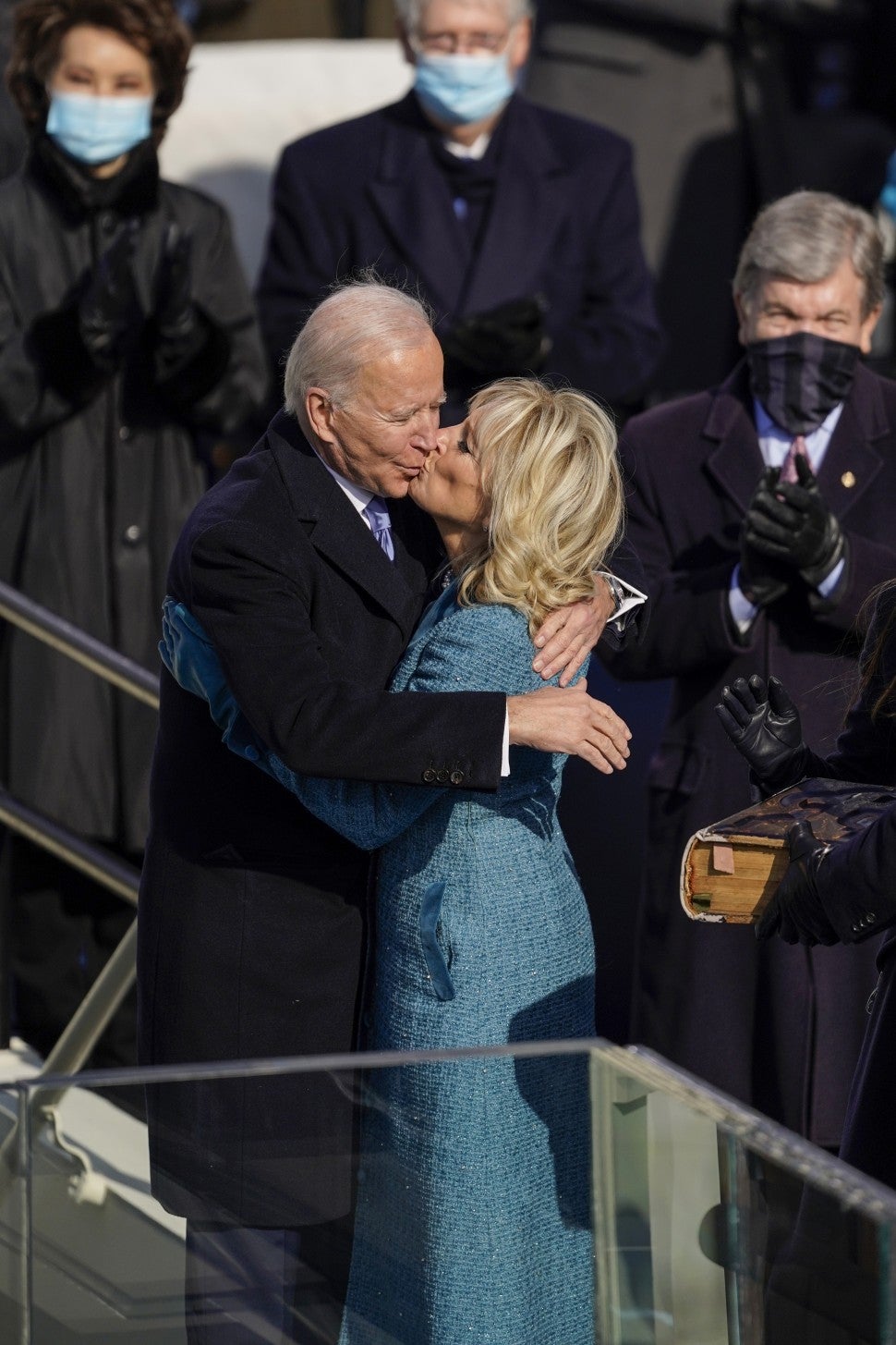 U.S. President Joe Biden(L) hugs his wife First Lady Jill Biden after taking the oath of office from Supreme Court Chief Justice John Roberts during the 59th presidential inauguration in Washington, D.C. on Wednesday, Jan. 20, 2021. 