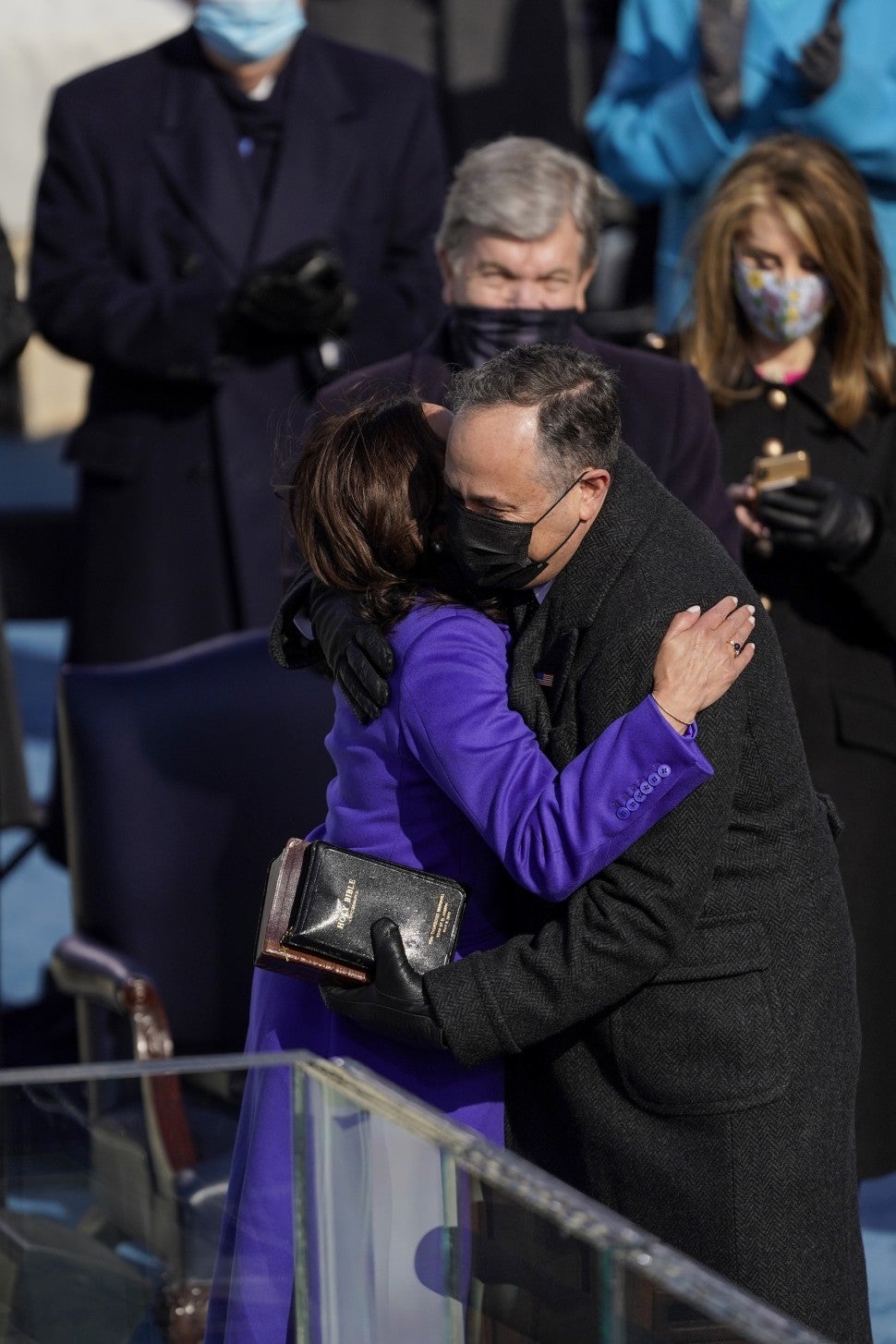 Kamala Harris(L) hugs her husband Douglas Emhoff after taking the oath of office from Supreme Court Justice Sonia Sotomayor during the 59th presidential inauguration in Washington, D.C. on Wednesday, Jan. 20, 2021.