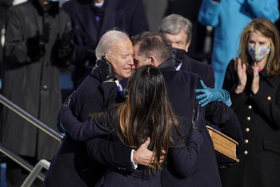  Joe Biden hugs his wife Jill Biden and children Hunter and Ashley Biden after he is sworn in as the 46th President of the United States Wednesday, Jan. 20, 2021, at the U.S. Capitol in Washington.