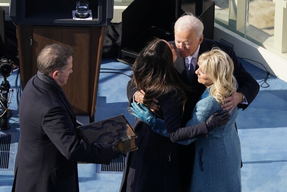 Joe Biden, flanked by his wife First Lady Jill Biden, is hugged by his children after taking the oath of office from Supreme Court Chief Justice John Roberts during the 59th Presidential Inauguration at the U.S. Capitol in Washington, January, 2021. 