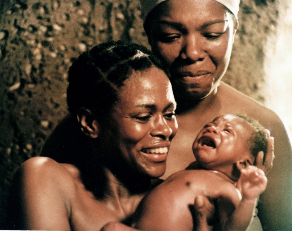 Binta (Cicely Tyson), her husband, Omoro, and Nyo Boto (Maya Angelou) welcome the birth of Kunta Kinte in 'Roots.'