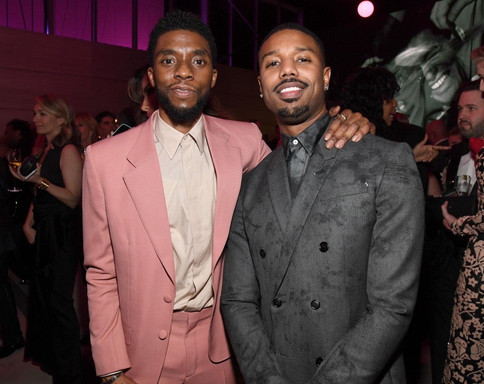 Chadwick Boseman (L) and Michael B. Jordan attend the 2019 Vanity Fair Oscar Party hosted by Radhika Jones at Wallis Annenberg Center for the Performing Arts on February 24, 2019 in Beverly Hills, California.
