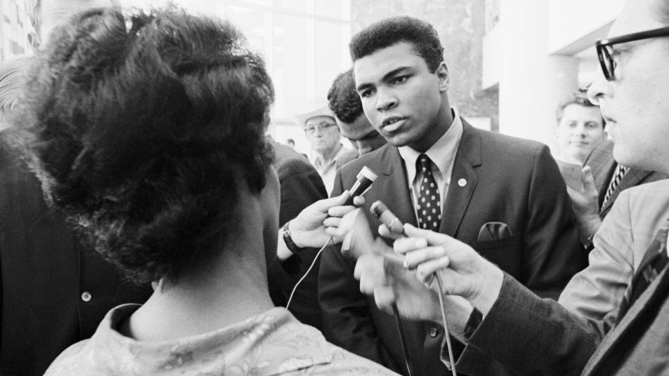 Boxer Muhammad Ali talking with the press after being indicted by a Federal Grand Jury for his refusal to be inducted into the armed forces. Ali contended that he was a Nation of Islam minister and not subject to the draft.