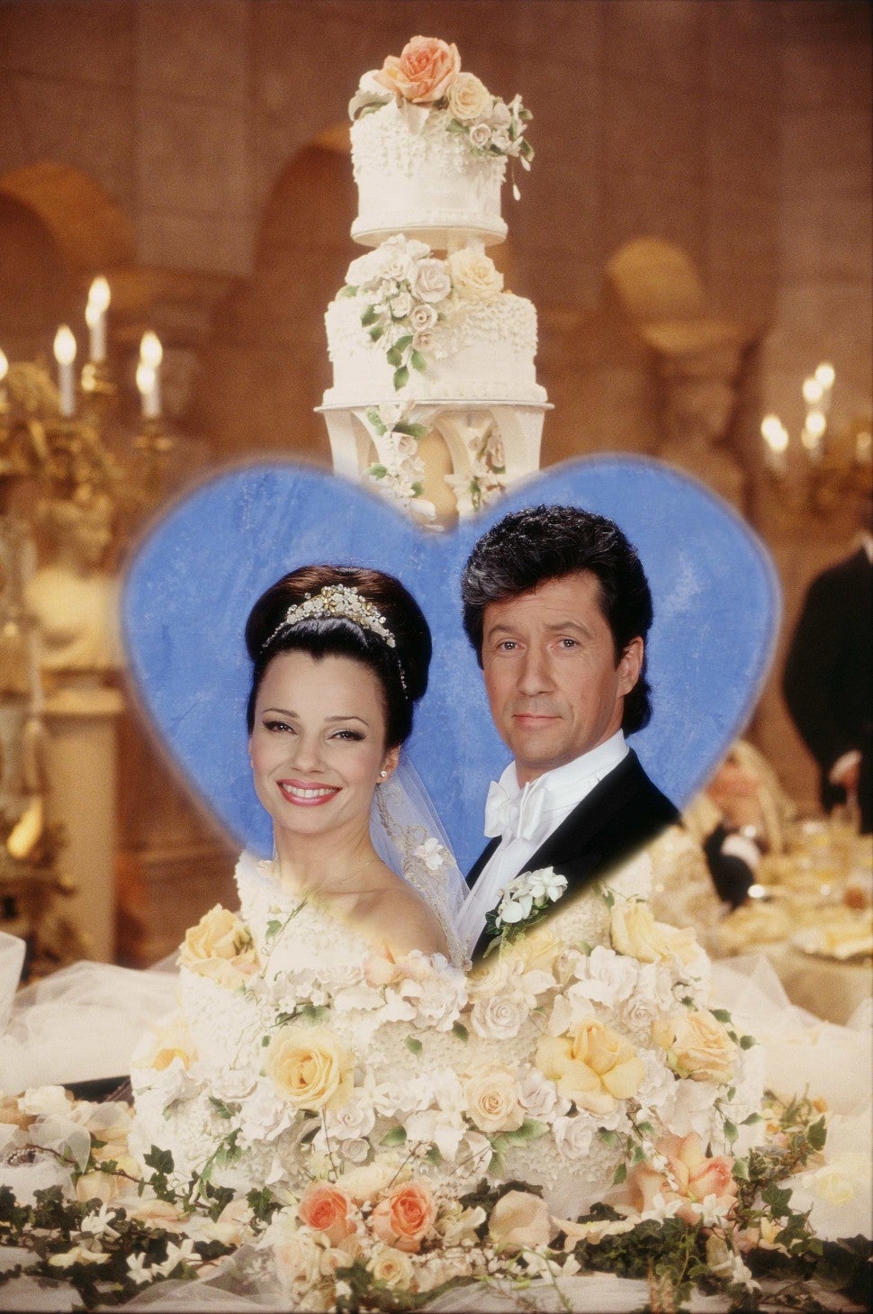 Fran Drescher and Charles Shaugnessy vignetted in a photo of the wedding cake from THE NANNY episode where their characters were marriedFran Drescher and Charles Shaugnessy vignetted in a photo of the wedding cake from THE NANNY episode where their characters were married