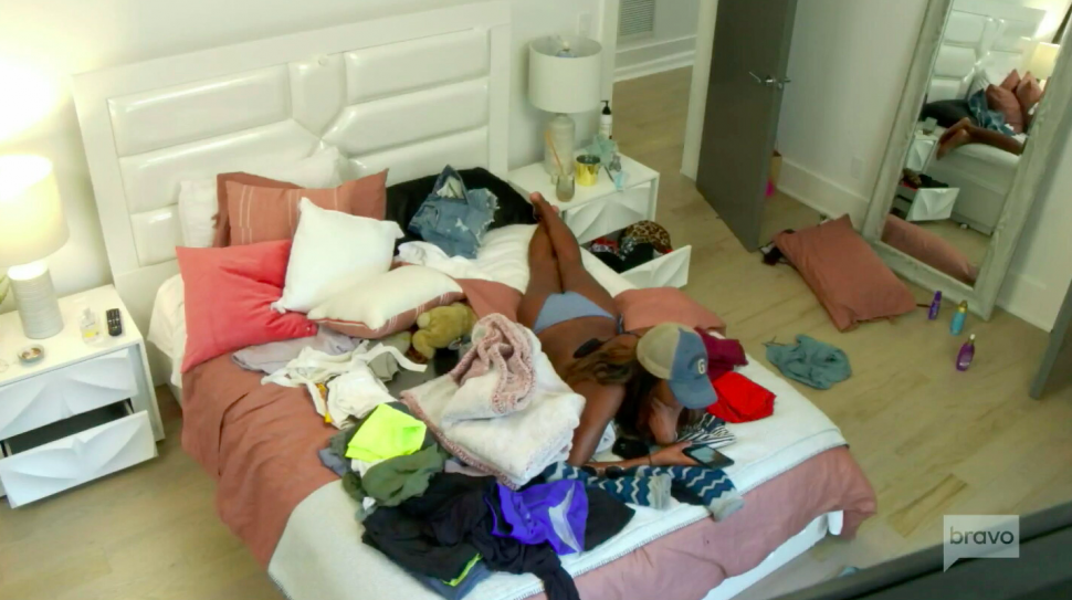 Ciara Miller lies in a messy bed on Summer House