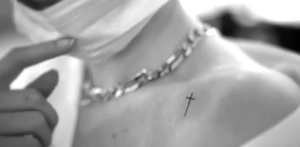Selena Gomez Cross Collarbone Tattoo