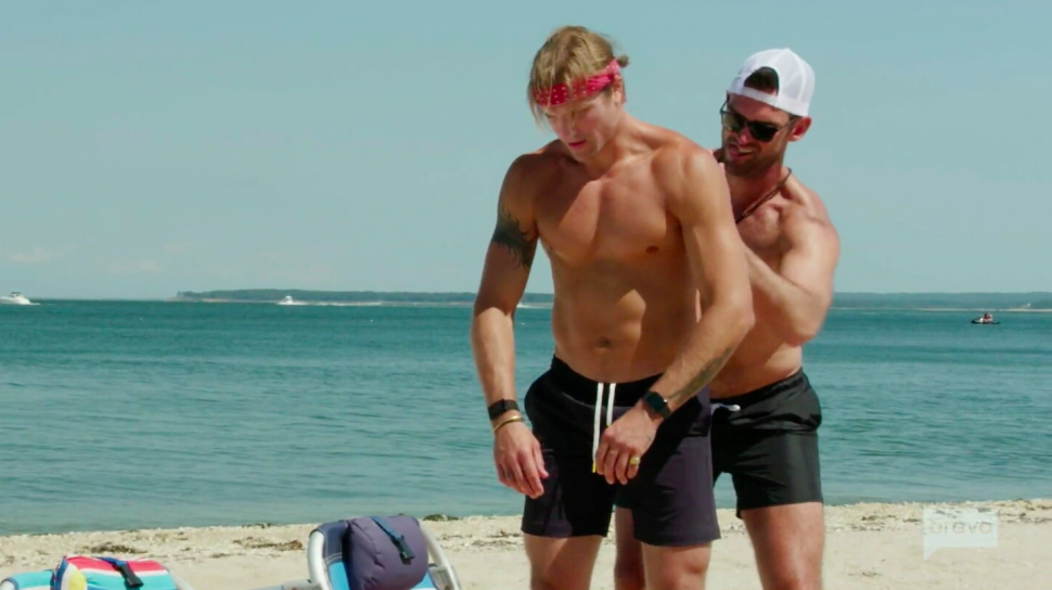 Carl Radke helps Summer House co-star Luke Gulbranson apply sunscreen 