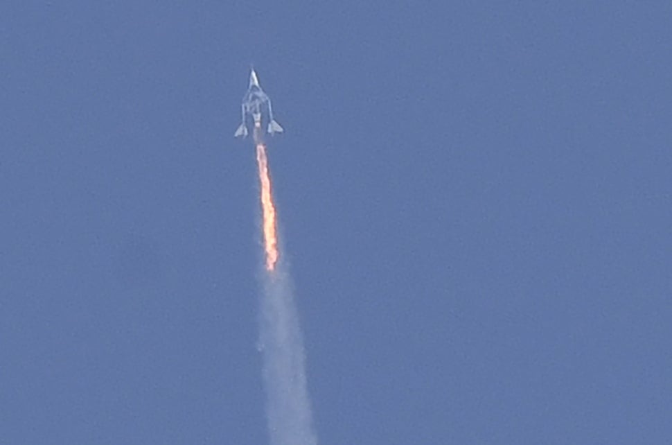 The Virgin Galactic SpaceShipTwo space plane Unity and mothership separate as they fly way above Spaceport America, near Truth and Consequences, New Mexico on July 11, 2021 on the way to the cosmos. 