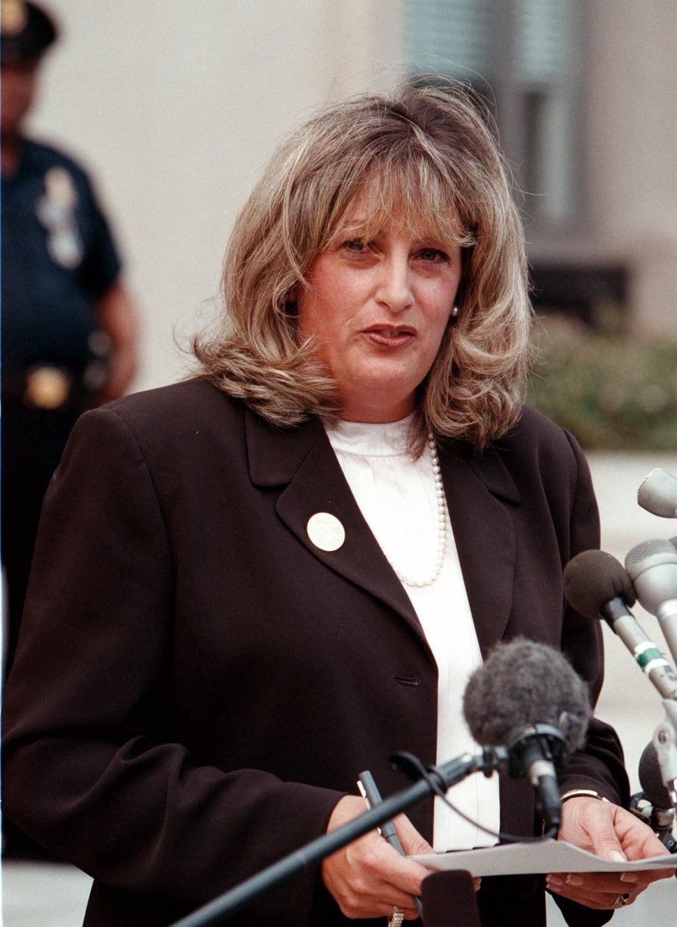 Linda Tripp talks to the press outside the Federal Courthouse July 29, 1998 in Washington, DC. After finishing her testimony before Kenneth Starr's grand jury, Linda Tripp, whose tape recordings of Monica Lewinsky led to an investigation of an alleged presidential affair, spoke at length publicly for the first time, saying she was an average American.