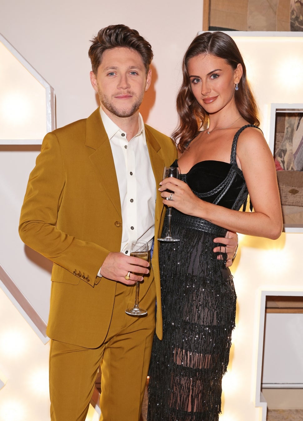 Niall Horan and Mia Woolley attend the Horan & Rose Show: Modest! Golf co-founder Niall Horan and Justin Rose brought the world of music and sport together at The Grove, presenting an evening of entertainment to raise money for The Black Heart Foundation on September 03, 2021 in Watford, England.