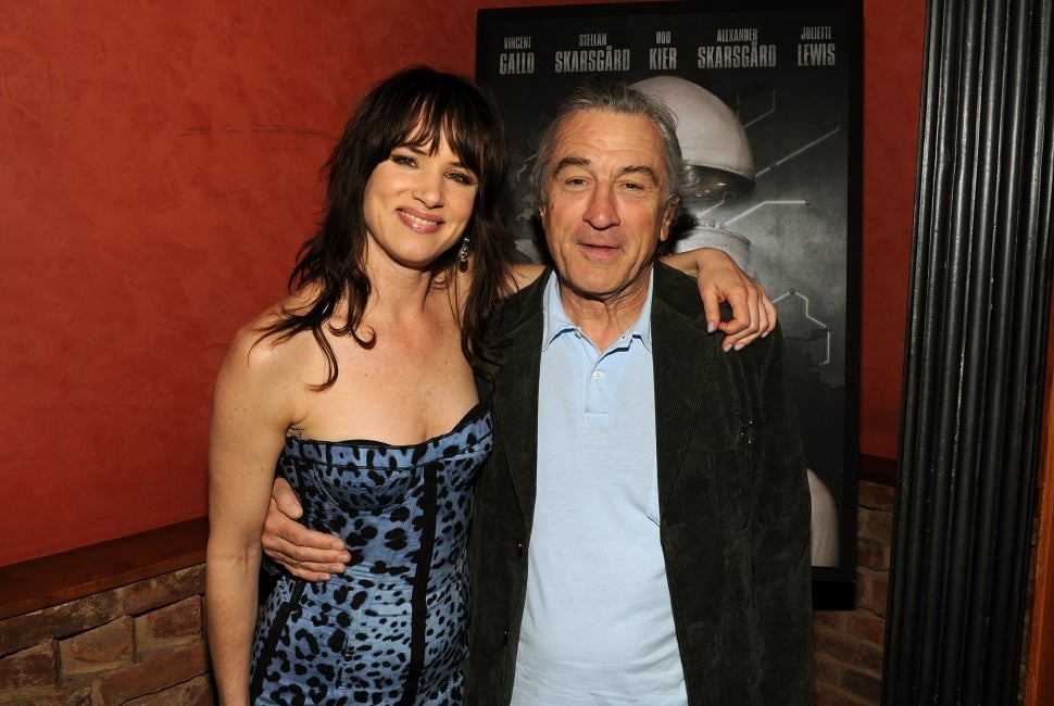 Juliette Lewis and Robert De Niro posing together in 2010.