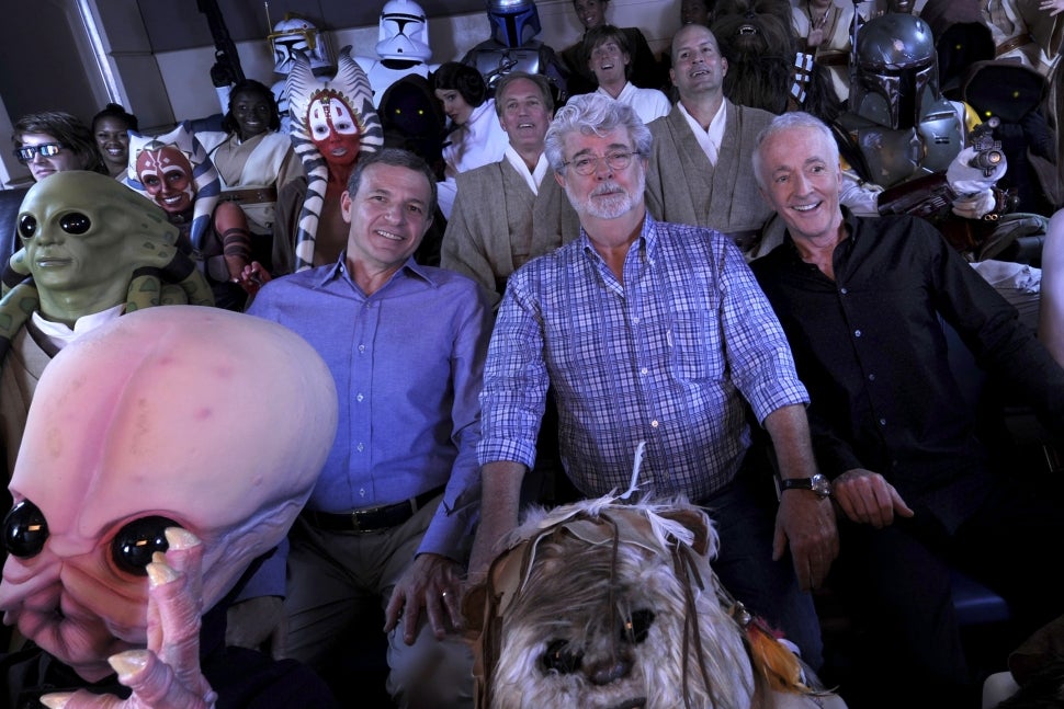 Bob Iger, George Lucas and Anthony Daniels riding Star Tours - The Adventure Continues.