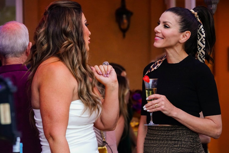 Emily Simpson and Heather Dubrow share a moment on The Real Housewives of Orange County