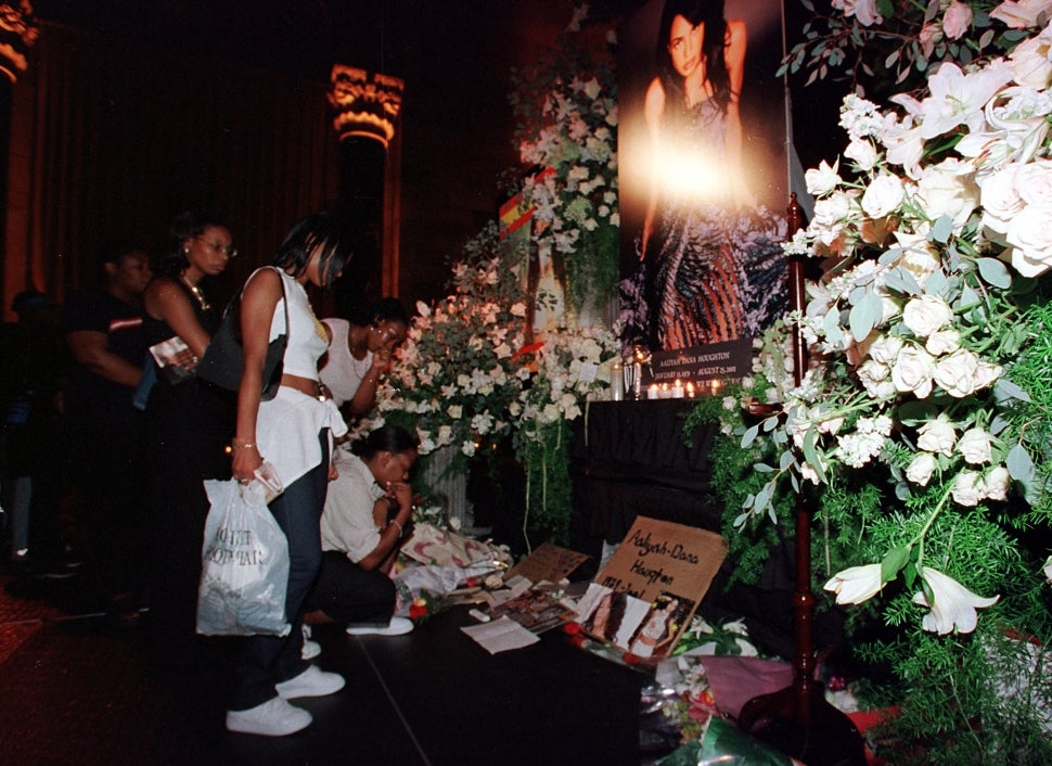 Fans line up to view a memorial for Aaliyah following her death.