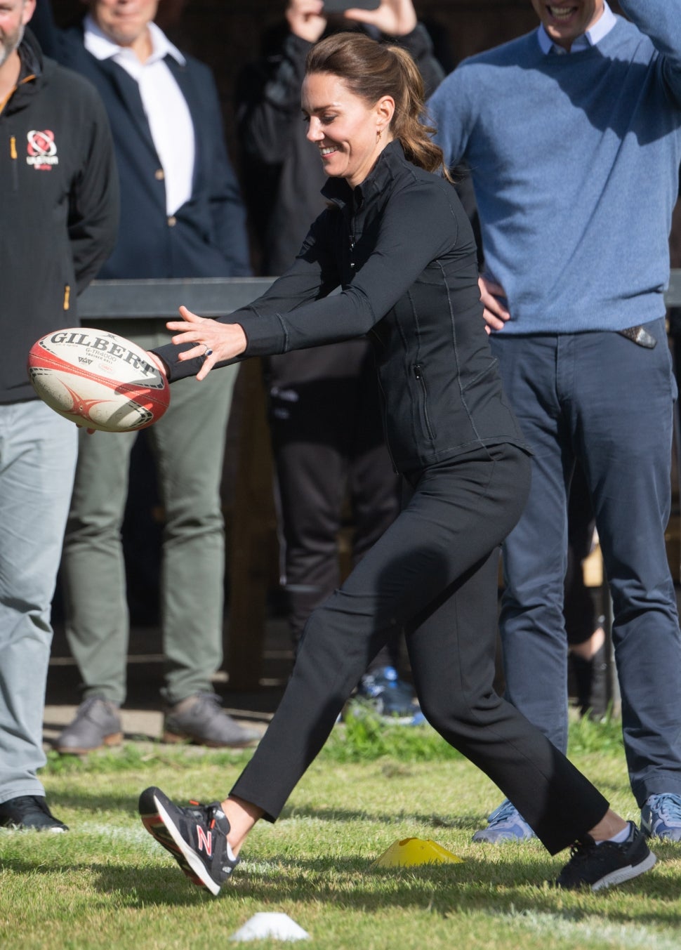 Catherine, Duchess of Cambridge kicks a rugby ball as she visits the City of Derry Rugby Club on September 29, 2021 in Londonderry, Northern Ireland.